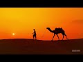 Camel Drivers at Sunset with Middle Eastern Music