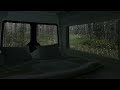 Rain on windows of car for camping in forest | car camping