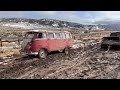 Off-roading a 23 window VW Bus In the snow and mud.