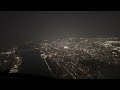 Flying up the Hudson River with view of Manhattan New York City at night.