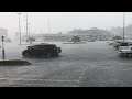 Summer storm makes waves in shopping parking lot.