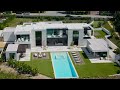 Touring an ALL Concrete MALIBU MANSION with a Waterfall Entry
