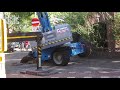 Boom lift plunges through sidewalk (RECOVERY)