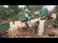 Incredible Overloaded Dump Truck Failed to Drive Up Hill Help By KOBELCO SK210LC Excavator & Truck