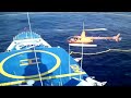Yellowfin tuna fishing operation in the Pacific Ocean with helicopter and speedboats
