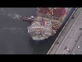 Baltimore Key Bridge collapse: Section of roadway that fell remains unbroken across container ship