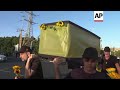Israeli protesters carry mock coffins as they call for the release of the Gaza hostages
