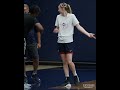 Paige Bueckers playfully arguing with Geno Auriemma