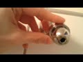 How do I remove this shower head ball?