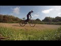 Slow motion mountain bike bunny hop from stand still.