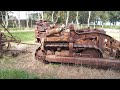 Rusty old International Harvester TD9 crawler dozer fitted with an Armstrong Holland blade