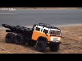 An all-terrain truck with six wheels that move freely.