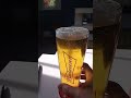 Pouring a can of Budweiser into a Budweiser pint glass