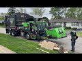 SBC Waste Front Loader Garbage Trucks Packing Bulk at the Spring Cleanup