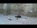 Beauty playing didgeridoo in Carcassonne France
