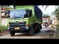 Large Truck Loaded with Tens of Tons Struggling in the Mud