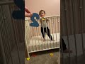 Lilli playing in her crib. 16 months old