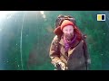 Russian man films thrilling walk across frozen ice on world’s deepest lake