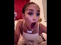 Stan Twitter: Doja Cat being shocked and covering her mouth after clicking on something