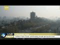 Live: Wuhan's Yellow Crane Tower with floating clouds and sunlit trees