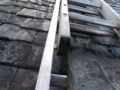 Repair a slipped slate on a roof