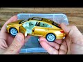Box of diecast car models: Bmw x7, Audi RS8, VW Passat show