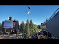 Wyoming Cowboy Football team entrance with 2 Blackhawk helicopters fly over