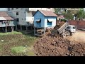 Video of pouring soil into the water next to to city to make it a 9x18 plot By Bulldozer Pushing
