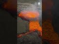 Lava flows from crater in Iceland during volcanic eruption