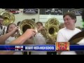 Reporter drops his microphone down tuba on live TV