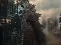 Ultraman punches Godzilla into a building