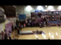 Police officer and student do a trick shot for swine week at EMHS