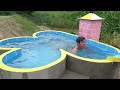 Build a heart-shaped hot water swimming pool with bricks and cement