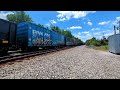 2 CSX trains at Featherstone Road in Woodbridge, VA with an SD70MAC.