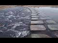 the sound of water flowing over a stepping stone