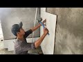 Construction Worker and Technique Installs Ceramic Tiles Walls - Tiling Skills