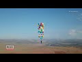 100 Helium Balloons Carry Man in Lawn Chair For 15 Miles
