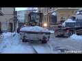 Volvo L90C loading snow on trucks