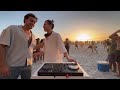 playing house music on the beach until people dance