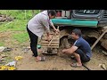 The driver and the girl repair the excavator damaged legs move.