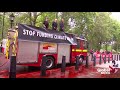 Climate activists lose control of fire hose while spraying 'fake blood' on UK Treasury