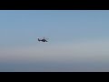 Coast Guard Helicopter flying over the Beach