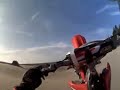 CR250 catching air and popping wheelies