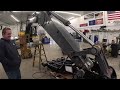 We turn a John Deere 350G excavator into a car crusher with a new pro link thumb and coupler!