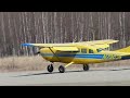 Cessna 207 landing at Lake Hood strip, Alaska