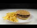 hamburger down on fried potato chips falling slow motion fast food junk food concept sbq