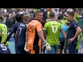 Tim Melia receives a yellow card after wild sequence with Cristian Roldan