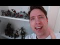 Why is this man sitting next to THOUSANDS of unpainted miniatures?