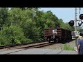 CSX M567, nearly 600 axles long, growls westbound through Voorheesville, NY on 7/20/23