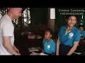 New Zealanders buy pens and books for charity for poor children at Kampong Phluk, Siem Reap Province